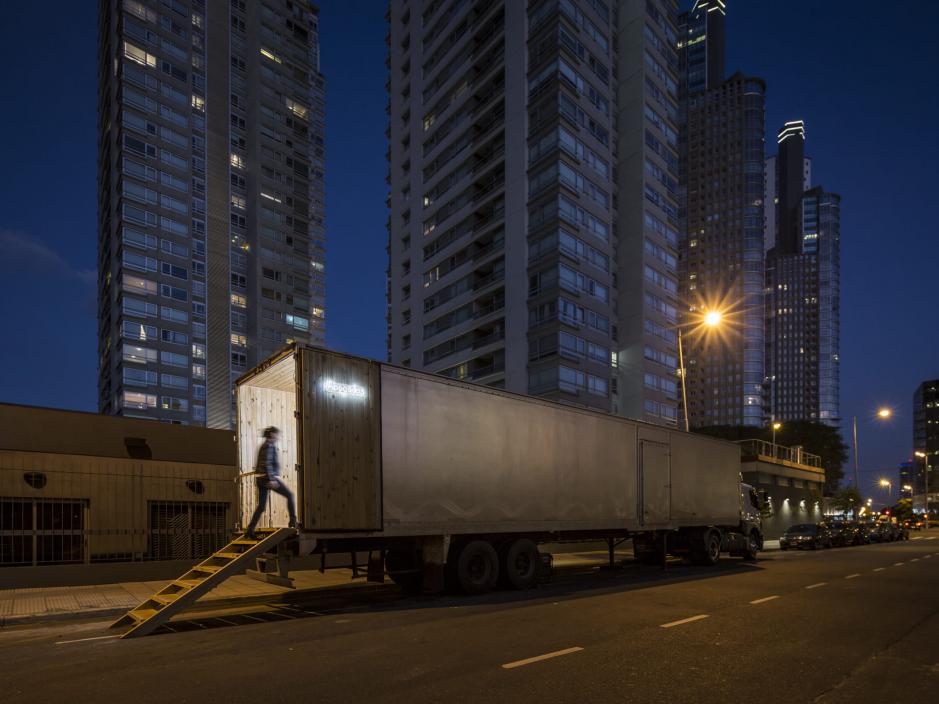 A person waling into a furnished semi truck bed 