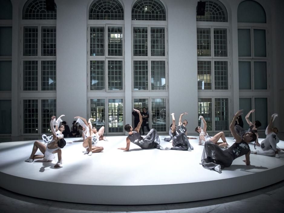 Dancers posing on a slightly elevated platform