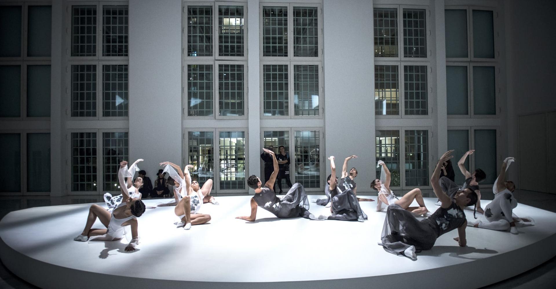 Dancers posing on a slightly elevated platform